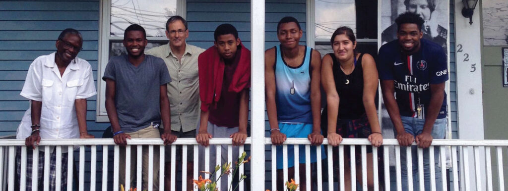 Group of people on the porch at the Ruggles center